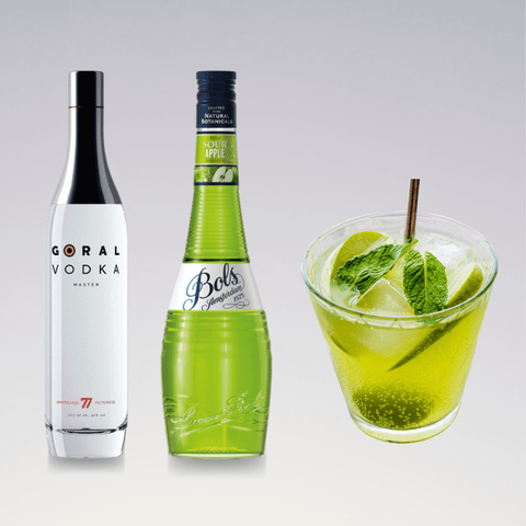 Appletini Cocktail with Goral Vodka, sour apple liqueur, garnished with mint leaves and ice in a glass.