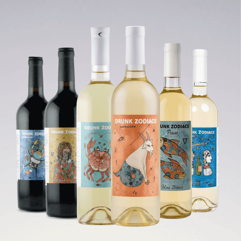 Drunk Zodiacs Artistic Zodiac wine bottles featuring zodiac-inspired artwork for Capricorn, Cancer, and Pisces.