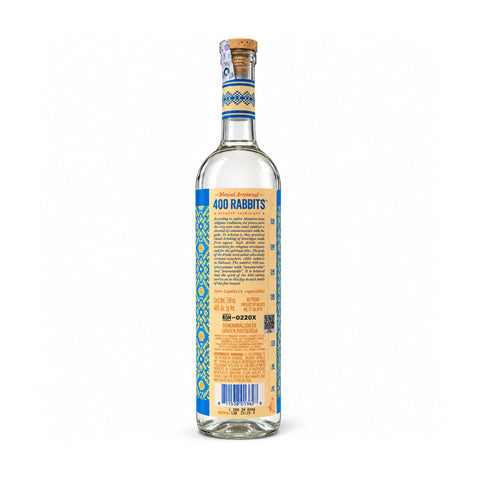 Back view of 750ml bottle of 400 Conejos Joven Mezcal, showcasing label design and details.