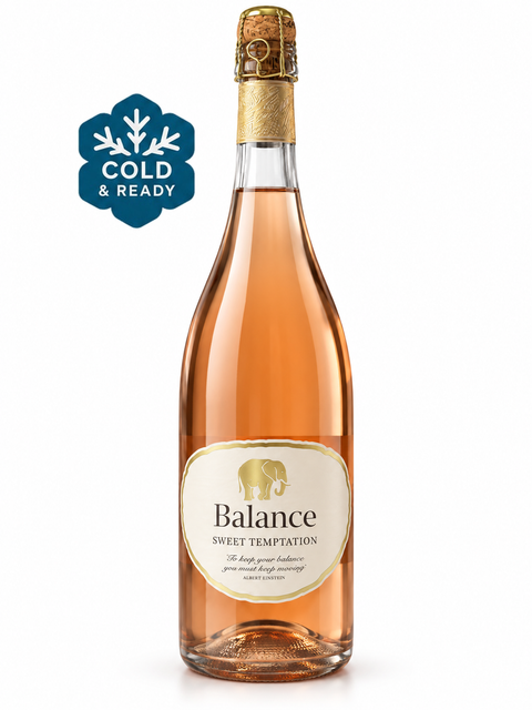 Bottle of Balance Sweet Temptation Rose Sparkling 750ml with 8% alcohol, showcasing its salmon-pink hue and festive presentation.
