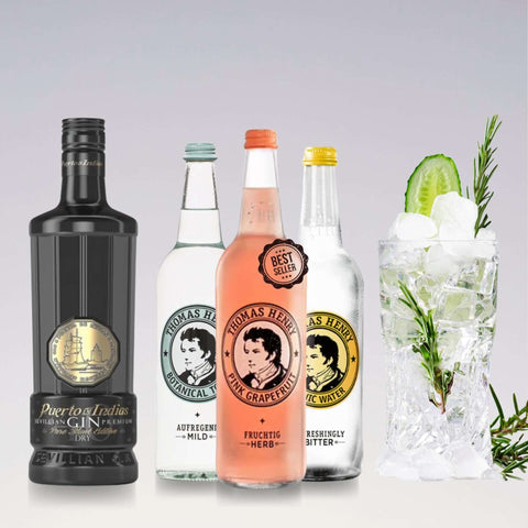 Gin and tonic ingredients, featuring Puerto de Indias Gin and Thomas Henry Tonic Water, with garnished cocktail glass.