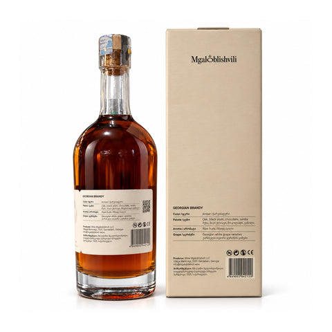 Mgaloblishvili VS Brandy 500ml bottle and gift box, Georgian brandy at 40% ABV, featuring clear glass and cream-colored packaging.