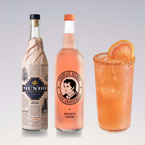 Alt Tag: Paloma cocktail with Tequila Mundo and Thomas Henry Pink Grapefruit Tonic, garnished with grapefruit slice and salt rim.