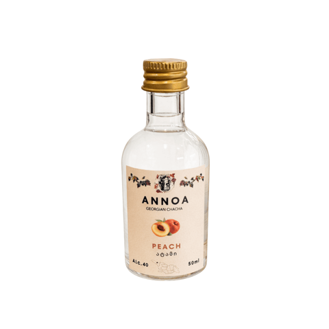 Annoa Georgian Chacha Peach 50ml bottle with label featuring peach imagery and traditional Georgian design.