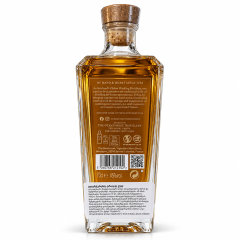 Back view of The Glenturret Triple Wood Single Malt Whisky 700ml bottle, showing label details and cork top.